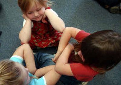 
Sorensen Elementary kindergartners, from left, Kahtiana Stoicheff, Victoria Cafferty and Jewelia Stage play a game in between art assignments at the school Monday. Because enrollment in the northern part of the county is growing and enrollment in the southern part is dwindling, the Coeur d'Alene school board is discussing ways to even out the distribution of students. Sorensen Elementary kindergartners, from left, Kahtiana Stoicheff, Victoria Cafferty and Jewelia Stage play a game in between art assignments at the school Monday. Because enrollment in the northern part of the county is growing and enrollment in the southern part is dwindling, the Coeur d'Alene school board is discussing ways to even out the distribution of students. 
 (Kathy Plonka/Kathy Plonka/ / The Spokesman-Review)
