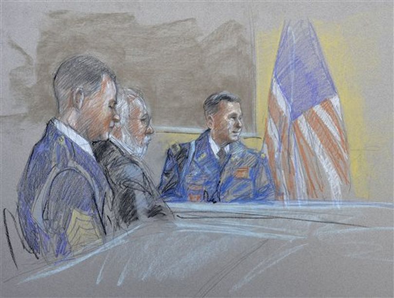 Capt. John Billings, right, is questioned as Sgt. Bowe Bergdahl, left, and lead defense counsel Eugene Fidell look on during a preliminary hearing to determine if Sgt. Bergdahl should face a court-martial, at Fort Sam Houston in San Antonio. Bergdahl, who left his post in Afghanistan and was held by the Taliban for five years, is charged with desertion and misbehavior before the enemy. (AP / Brigitte Woosley)