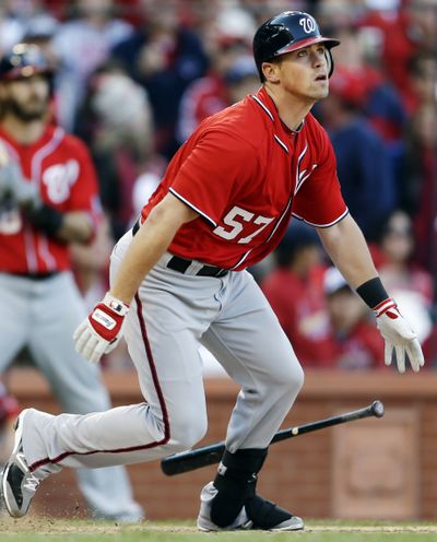 Washington’s Tyler Moore watches his two-run single in the eighth inning that proved to be the winning runs in the Nationals’ 3-2 victory over the Cardinals. (Associated Press)