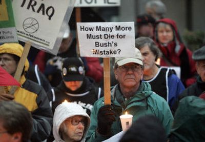 
Between 100 and 300 people gathered to protest the war a day after the American death toll in Iraq reached 3,000. 
 (The Spokesman-Review)
