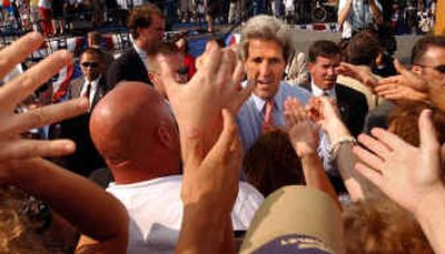 Democratic presidential candidate Sen. John Kerry, D-Mass., shakes hands during a campaign rally in Dayton, Ohio, on Wednesday.
(Associated Press / The Spokesman-Review)