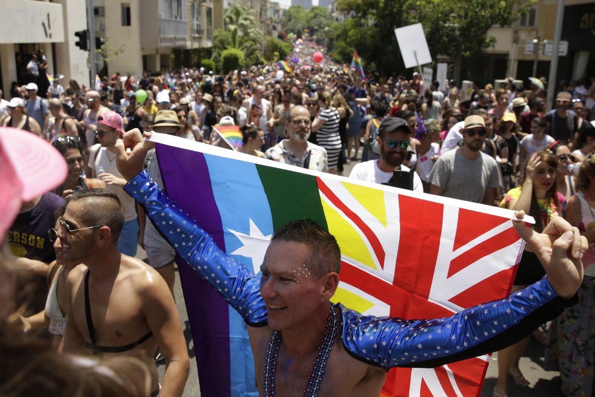 Israelis and tourists participate in the Gay Pride parade in Tel Aviv, Israel on Friday, June 8, 2018. The Tel Aviv Municipality said 250,000 people celebrated on Friday. (Sebastian Scheiner / AP)