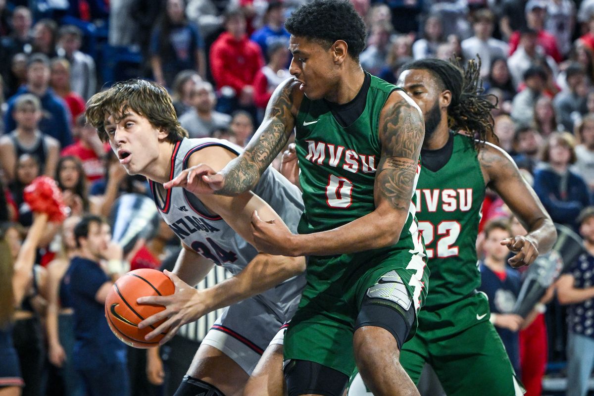 Gonzaga forward Braden Huff (34) tries to get a look at the basket as Mississippi Valley State guard Rayquan Brown (0) and forward Reginald Reynolds (22) defend during a NCAA college basketball game, Monday, Dec. 11, 2023, in the McCarthey Athletic Center.  (COLIN MULVANY)