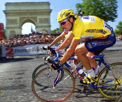 
Lance Armstrong rides toward his first Tour de France title in 1999, the year  L'Equipe claims the American used EPO. 
 (Associated Press / The Spokesman-Review)
