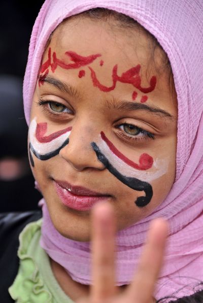 Yemeni girl, her face painted with the colors of the national flag, Monday. (Associated Press)