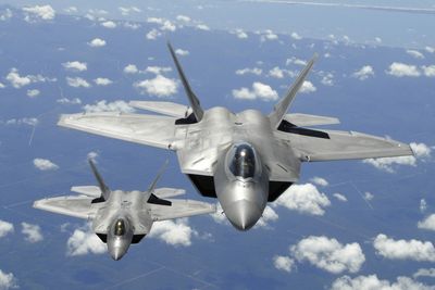 Two Air Force F-22 Raptor fighter aircraft fly  during a training mission off the coast of Florida  in 2007. The Air Force has 143 of the Lockheed-built, twin-engine fighters in its fleet and is waiting for delivery of 44 more.  (File Associated Press / The Spokesman-Review)