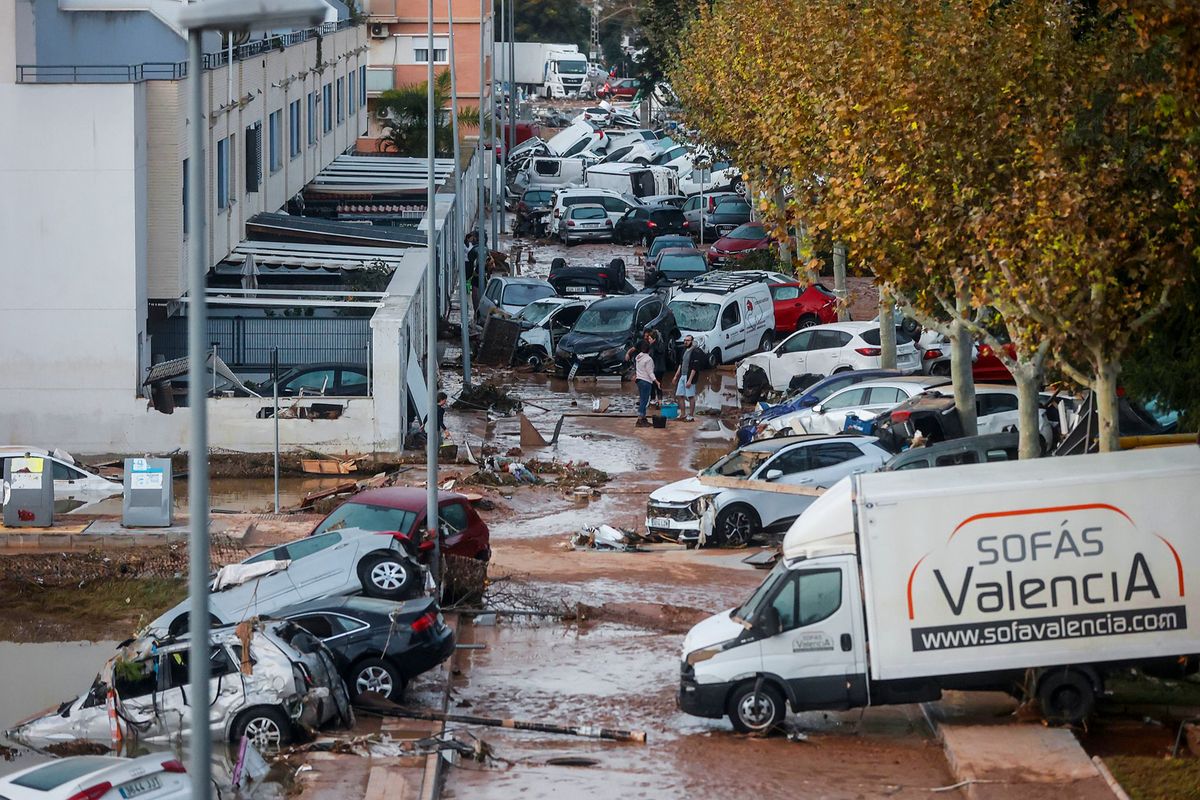 Cars that were washed away by the violent storm in Valencia, Spain, this week stand after the passage of a weather phenomenon known as a “cold drop” or “dana.”  (Rober Solsona/Europa Press/dpa/TNS)