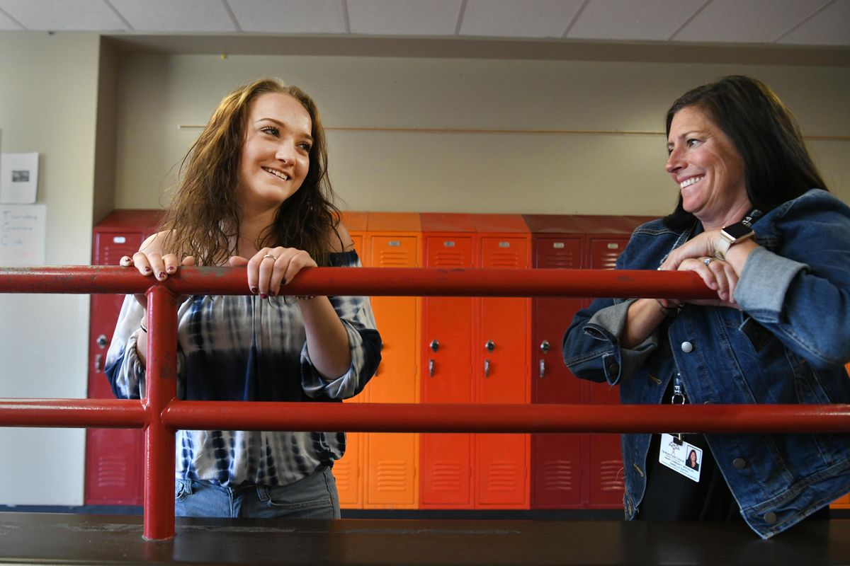 Amanda Harpole, left, with counselor Danielle Duffey is nearing graduation at North Central High School. Harpole has lived with her aunt, grandmother and a sister over her four years of high school and credits counselors and teachers at NCHS for helping her finish  high school. (Jesse Tinsley / The Spokesman-Review)