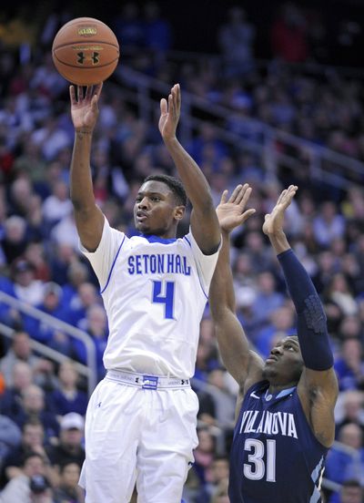 Seton Hall's Sterling Gibbs, left, led the Pirates’ upset with 20 points. (Associated Press)