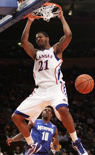 Kansas' Markieff Morris dunks the ball for two of his 16 points.  (Associated Press)