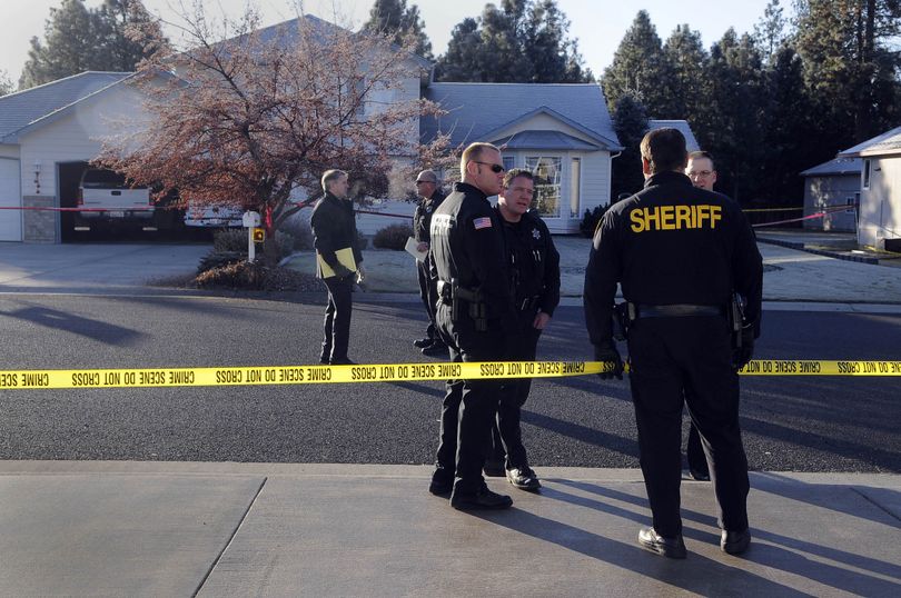 Deputies from the Spokane County Sheriff's Office gather outside the the house at 4518 Woodglen to investigate a homicide, December 2, 2009 north of Mead in a development of upscale homes on the south side of Day-Mount Spokane Road. (Dan Pelle / The Spokesman-Review)