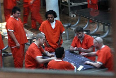 
Inmates at the Kootenai County Jail in Coeur d'Alene play cards  Tuesday. Under a plan set to go before Spokane County commissioners, Geiger Corrections Center  in Spokane would offer to house up to 30 male inmates from Kootenai County. 
 (Kathy Plonka / The Spokesman-Review)
