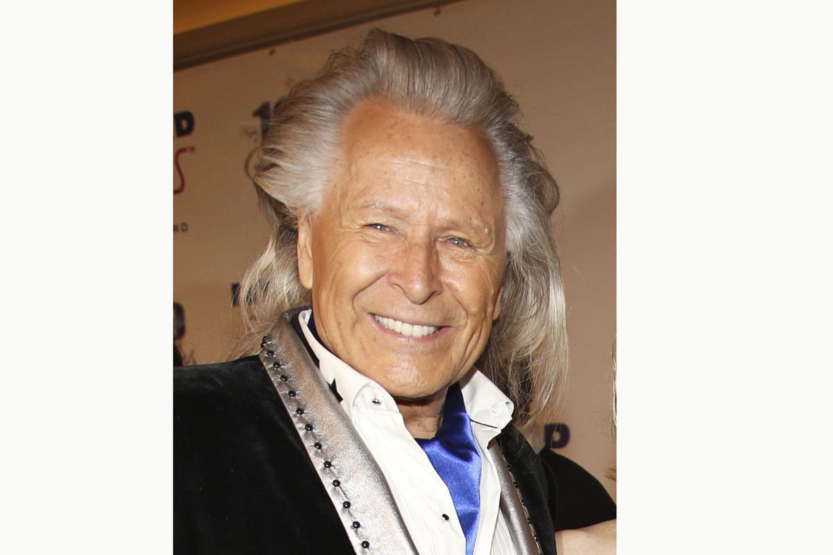 FILE - Peter Nygard attends the 24th Night of 100 Stars Oscars Viewing Gala on March 2, 2014, in Beverly Hills, Calif. Nygard faces criminal charges in New York after his Canadian arrest on charges alleging that he dangled opportunities in fashion and modeling to lure dozens of women and girls to have sex with himself and others. The 79-year-old Nygard awaited an appearance in a Winnipeg courtroom after his Monday, Dec. 14, 2020, arrest in Winnipeg, Manitoba, Canada by Canadian authorities at the request of the United States.  (Annie I. Bang)