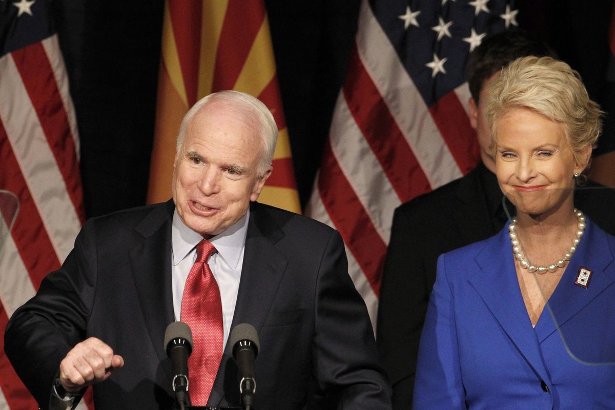 Sen. John McCain, R-Ariz., left, speaks at an election night victory party with his wife Cindy McCain on Tuesday in Phoenix. McCain routed conservative challenger J.D. Hayworth. (Associated Press photos)