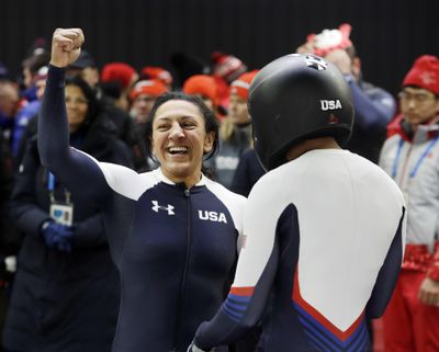 Driver Elana Meyers Taylor, left, and Lauren Gibbs of the United States celebrate after their silver medal winning heat during the women’s two-man bobsled final at the 2018 Winter Olympics in Pyeongchang, South Korea, Wednesday, Feb. 21, 2018. (Michael Sohn / Associated Press)