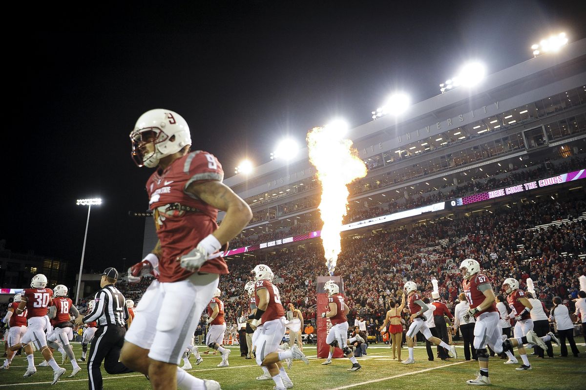 Washington State Cougars wide receiver Gabe Marks (9) takes the field to face Cal as pyrotechnics explode before the first half of a college football game on Saturday, Nov 12, 2016, at Martin Stadium in Pullman, Wash. (Tyler Tjomsland / The Spokesman-Review)