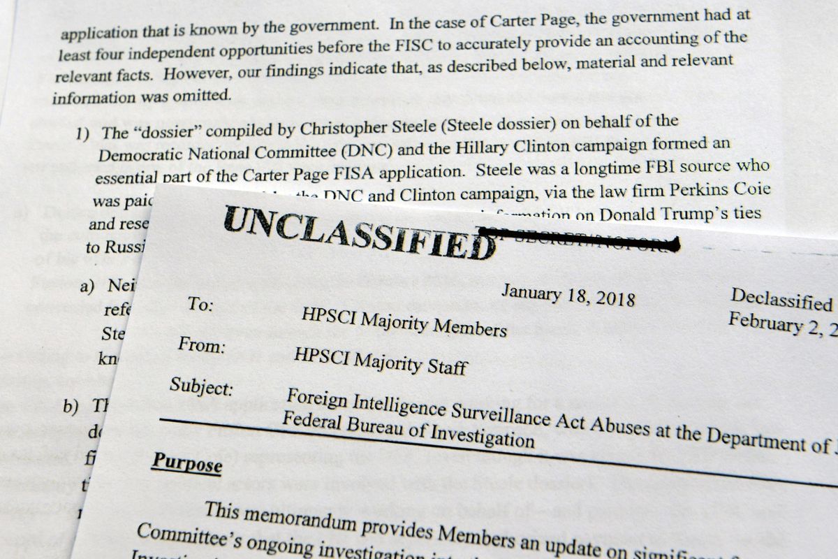 A intelligence memo is photographed in Washington, Friday, Feb. 2, 2018. After President Donald Trump declassified the memo, the Republican-led House Intelligence Committee released the memo based on classified information that alleges the FBI abused U.S. government surveillance powers in its investigation into Russian election interference. (Susan Walsh / Associated Press)