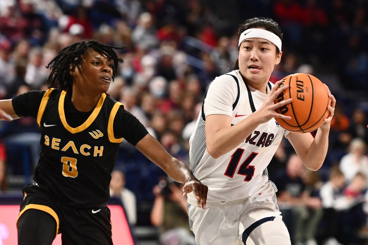Gonzaga Bulldogs guard Kaylynne Truong , right, drives the lane against Long Beach State 49ers guard Ma’Qhi Berry at the McCarthey Athletic Center on Nov. 11.  (James Snook/For The Spokesman-Re)