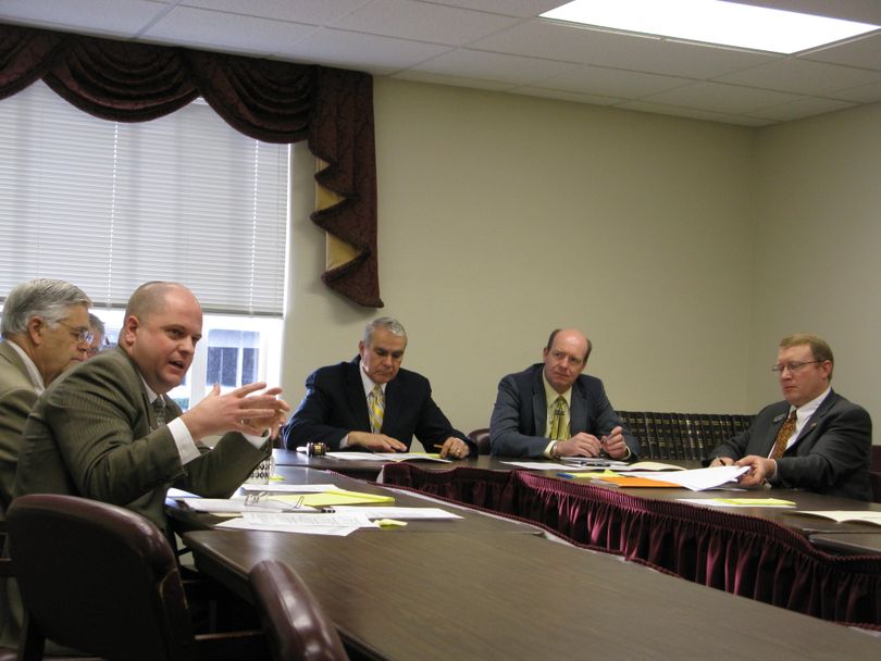 House Assistant Minority Leader James Ruchti, D-Pocatello, questions the governor's chief of staff, Jason Kreizenbeck, about registration fees for heavy trucks. Kreizenbeck said Ruchti was correct that higher state fees don't drive interstate truckers to register in another state, because they pay fees proportionally based on the number of miles they travel in each state. (Betsy Russell / The Spokesman-Review)