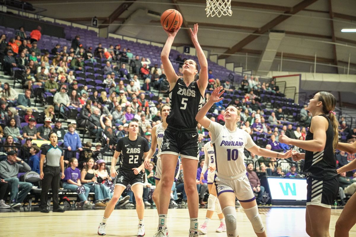 Gonzaga forward Maud Huijbens goes for a layup against Portland guard Natalie Fraley on Thursday at Chiles Center in Portland.  (Courtesy of Gonzaga Athletics)