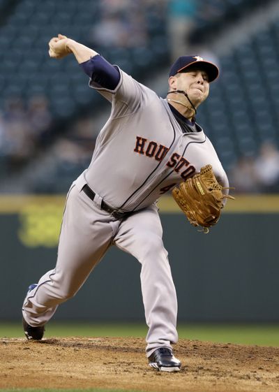 Houston Astros starting pitcher Brad Peacock throws against the Seattle Mariners in the first inning. (Associated Press)