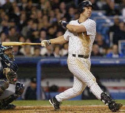 
New York's Tino Martinez homers in the third. 
 (Associated Press / The Spokesman-Review)