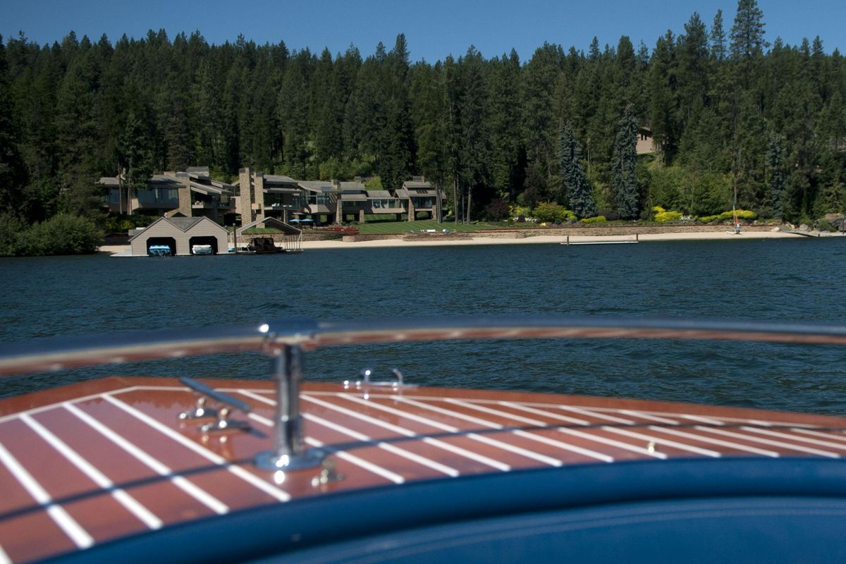 The boat approches Hagadone Gardens, the home of Duane and Lola Hagadone on Casco Bay in Coeur d