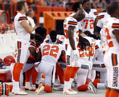 FILE - This Aug. 21, 2017, file photo shows members of the Cleveland Browns kneeling during the national anthem before an NFL preseason football game against the New York Giants, in Cleveland. (Ron Schwane / Associated Press)