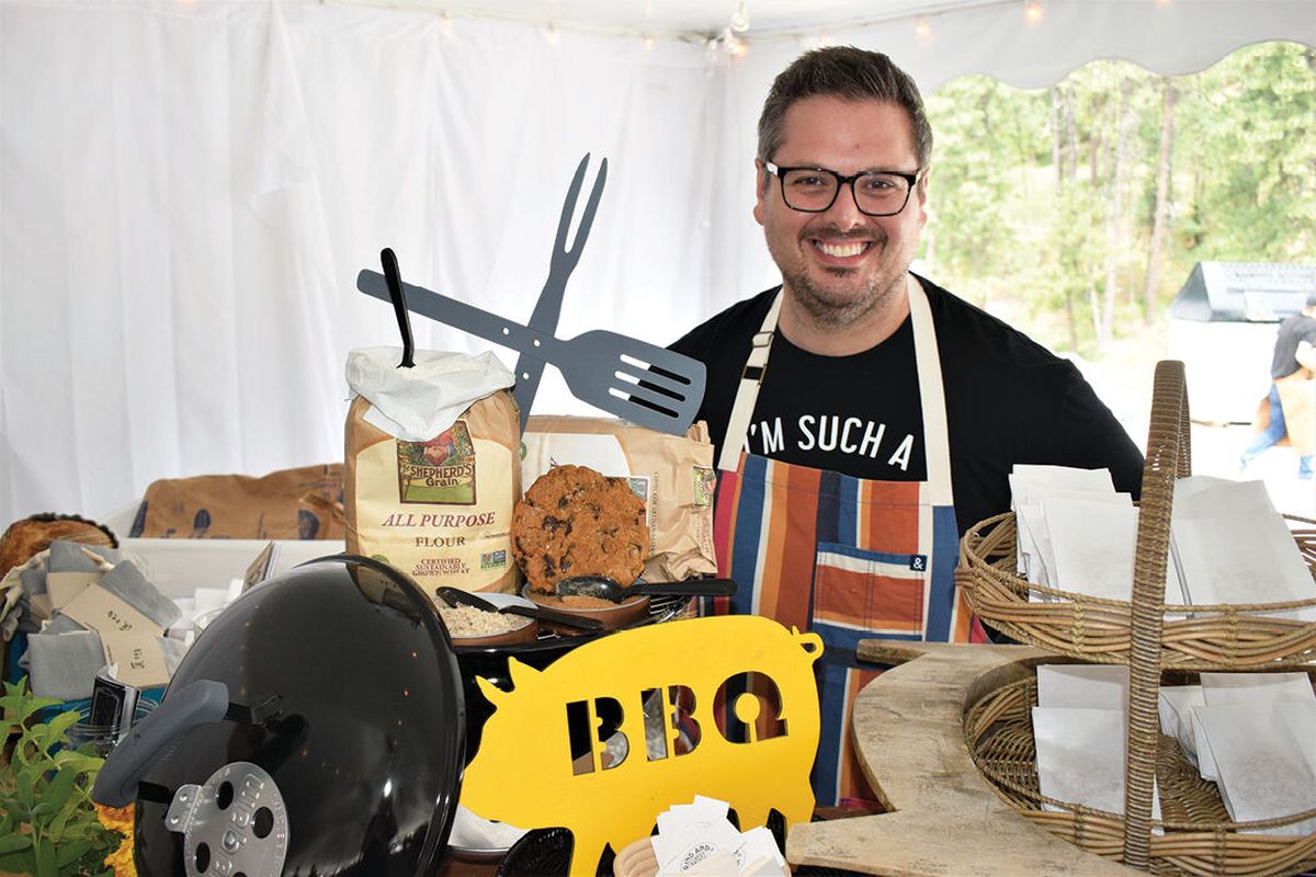 Ricky Webster of Rind and Wheat offers smoked chocolate chip cookies at From the Ashes Idaho in Post Falls on June 19. Rind and Wheat is located in Browne’s Addition.  (Don Chareunsy/The Spokesman-Review)