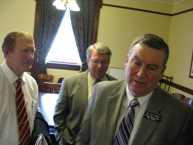 House GOP leaders, from left, Ken Roberts, Lawerence Denney and Scott Bedke emerge from a closed-door caucus Wednesday, refusing to say whether a controversial ultrasound bill is dead. The hearing on the bill tomorrow has been canceled. (Betsy Russell)