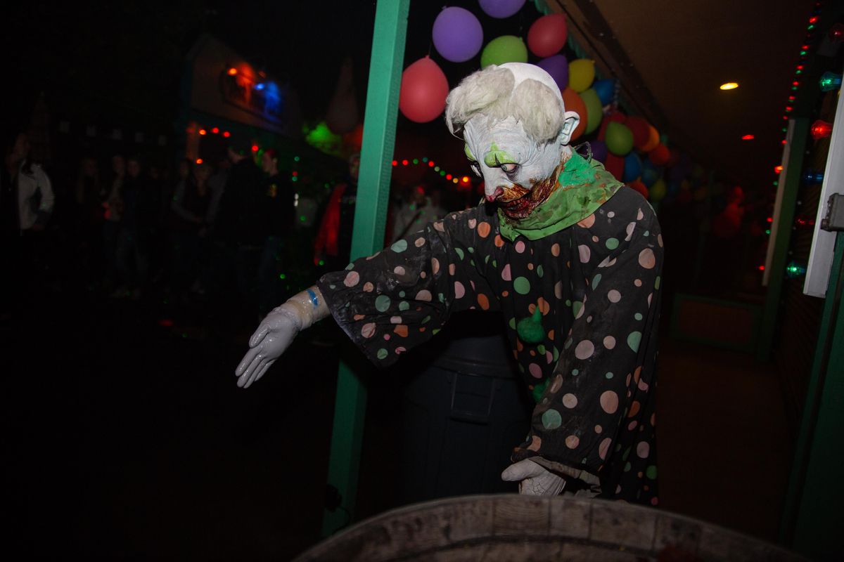 A mechanical clown dummy shakes and swerves on Sept. 28, 2018, at Scarywood in Athol. The colorful clowns, which are actors and dummies, were in great numbers in Clown Town. (Libby Kamrowski / The Spokesman-Review)
