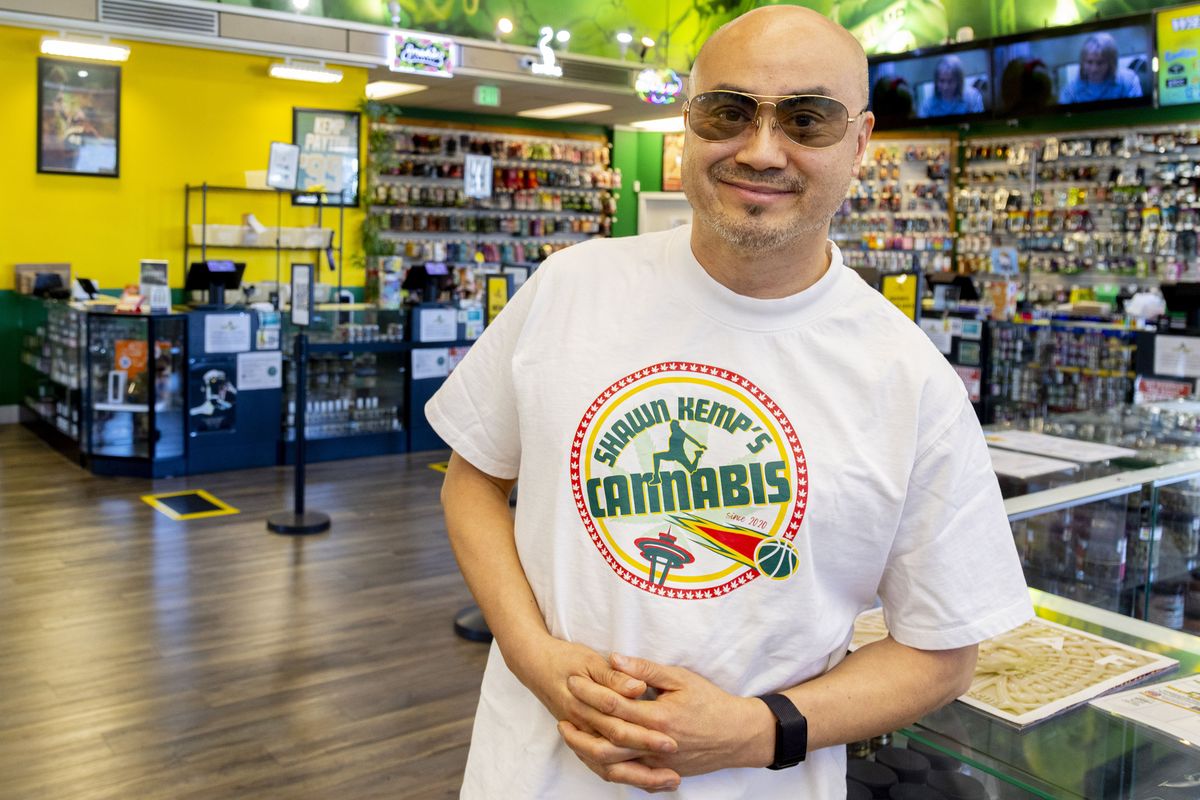 Tran Du, manager of Kemp’s Cannabis, inside the Seattle dispensary, one of the city’s largest and most affordable, on Tuesday.  (Akash Pamarthy)