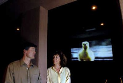 
A photo of Lucy the gosling is in the background while Carol Muzik, right, talks with filmmaker Chad Christensen at the Post Falls Theater on Monday. Muzik raised the orphaned gosling, and paired with Christensen to make a short film about the experience. 
 (Kathy Plonka / The Spokesman-Review)