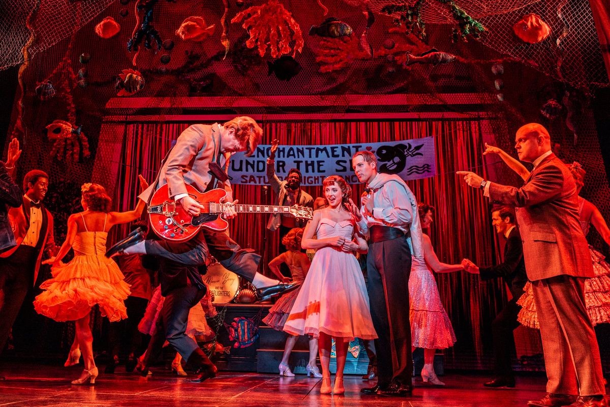 Lucas Hallauer (Marty McFly) rocks out on guitar as Mike Bindeman (George McFly) looks on, with the Broadway nationally touring company of “Back to the Future: The Musical.”  (Courtesy of Evan Zimmerman)