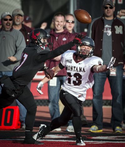 EWU’s Jake Hoffman, left, gets a hand on a pass intended for Montana’s Joshua Janssen. (Colin Mulvany)
