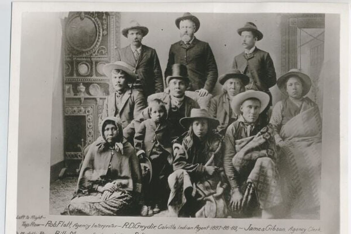 Left to right, top row, are agency interpreter Robert Flett; Colville Indian Agent R.D. Gwydir; agency clerk James Gibson. In middle row, left to right, are Spokane member Billy Mason; Coeur d’Alene Chief Seltice; Upper Spokane Chief Garry; and a nephew of Seltice. In the lower row, left to right, are Nellie, daughter of Chief Garry; a Coeur d’Alene member; and sub-chief Pierre Bartholomew. The group was attending an 1887 Agreement signing when U.S. representatives came to convince the Upper and Middle Spokans to move to Jacko, Coeur d’Alene or Colville reservations.  (Northwest Museum of Arts and Culture)