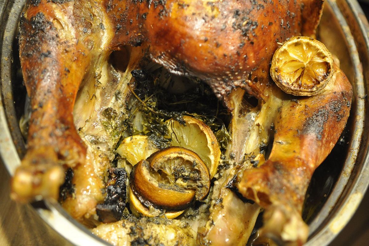 Stuffed with citrus and fresh herbs and basted with beer, this turkey turned out moist and full of flavor. (Adriana Janovich / The Spokesman-Review)