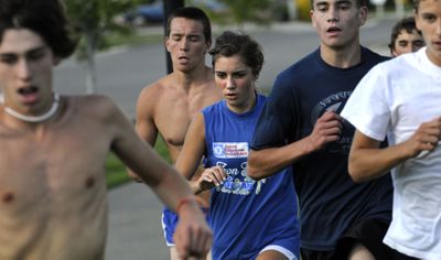 Kinsey Gomez, center, will be defending her state title this year.  (Kathy Plonka / The Spokesman-Review)