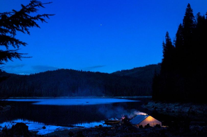 Night falls on a spring boat-in tent camp at a primitive site on Dworshak Reservoir. (Jed Conklin)