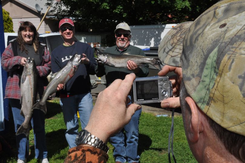 Anglers pose with their spring chinook salmon at The Guide Shop in Orofino, Idaho, after returning from a Clearwater River fishing trip. (Rich Landers)