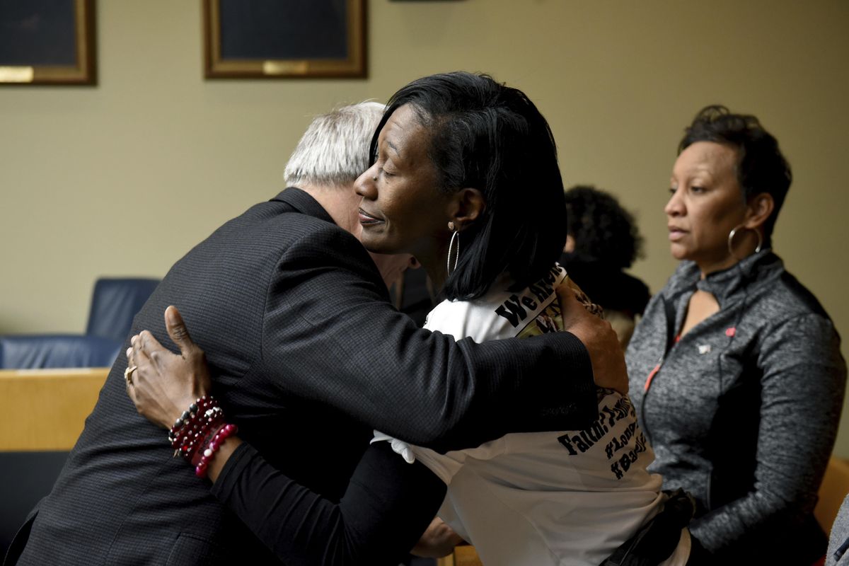 Zenobia Dobson hugs Assistant District Attorney Phil Morton Thursday, Dec. 14, 2017, in Knoxville, Tenn., after a jury convicted Christopher Bassett of first degree murder and Kipling Colbert Jr. and Gregory Williams III of facilitation in the killing of her son Zaevion Dobson. (Michael Patrick / AP)