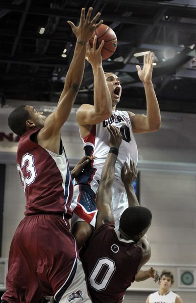 Loyola Marymount’s Jarrd DuBois (0) fouls Gonzaga’s Elias Harris as he drives to the basket.chrisa@spokesman.com (CHRISTOPHER ANDERSON)