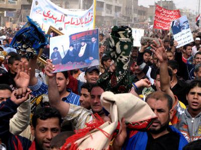 
Demonstrators protest the U.S. military presence in Sadr City, a Shiite enclave in Baghdad. About 10,000 people marched Friday in opposition to a joint base for US and Iraqi forces.
 (Associated Press / The Spokesman-Review)