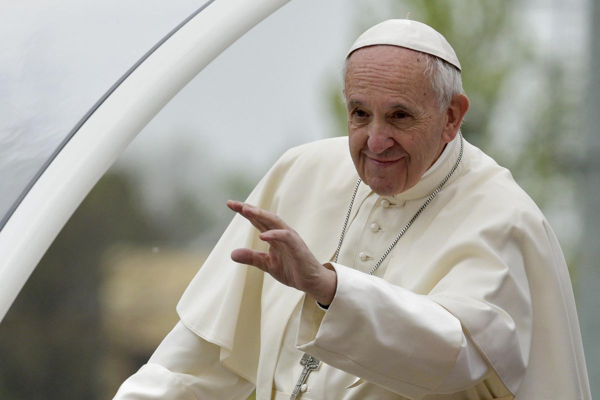 Pope Francis waves as he arrives at Dorando Pietri stadium in Carpi, northern Italy, for a one-day pastoral visit to Carpi and Mirandola, Sunday. (Marco Vasini / Associated Press)