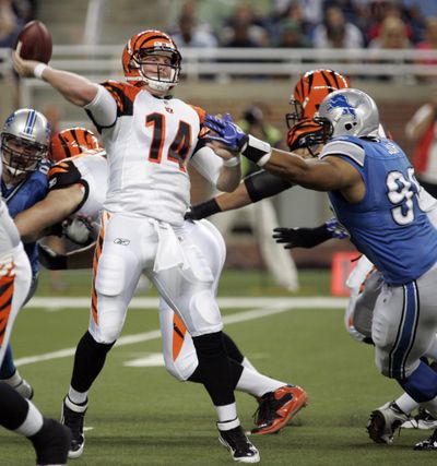 Detroit tackle Ndamukong Suh, right, was fined $20,000 for roughing Bengals quarterback Andy Dalton later in Friday’s game. (Associated Press)