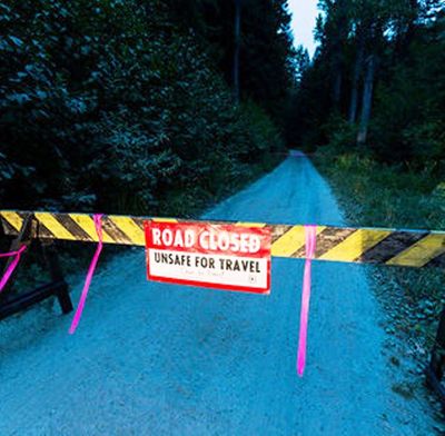 A barricade, blocking access to forest road 691, is among several closures due to fire danger in the North Fork Coeur d'Alene River drainage area.  (Shawn Gust / Coeur d'Alene Press)
