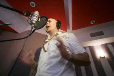 
Hip-hop star Pitbull sings Wednesday while recording a Spanish-language version of the U.S. national anthem in Miami. 
 (Associated Press / The Spokesman-Review)