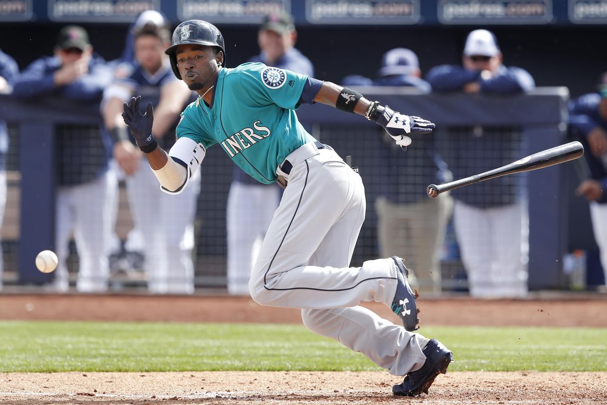 Seattle Mariners’ Dee Gordon bunts during the second inning of a  Spring Training game against the San Diego Padres in Peoria, Arizona. Much of the optimism about Seattle’s offense is because of the addition of Gordon. (Charlie Neibergall / AP)