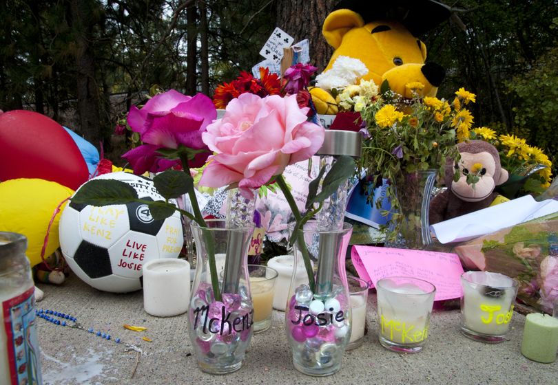 A memorial of flowers, stuffed animals and messages are displayed Wednesday at the site where University High School students McKenzie Mott and Josie Freier were killed in a car accident Saturday night. (Dan Pelle)