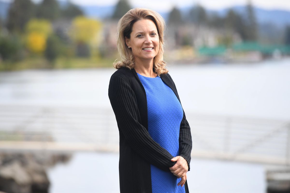 Laura Little, standing along the Spokane River in Post Falls, is a producer of the Broadway musical "Come From Away," which earned seven Tony Award nominations on Tuesday, including Best Musical. (Jesse Tinsley / The Spokesman-Review)